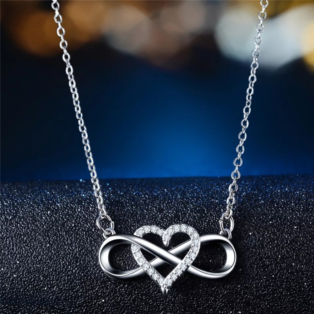 Silver heart shaped infinity love necklace.